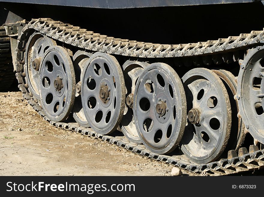 A large tank on wheels chains