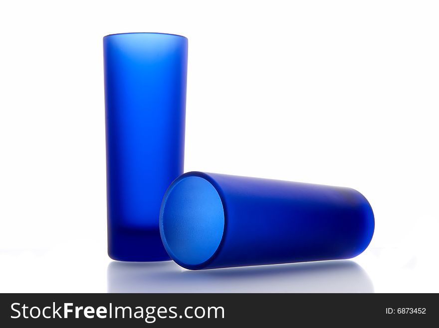 Two dark blue glasses on a white background