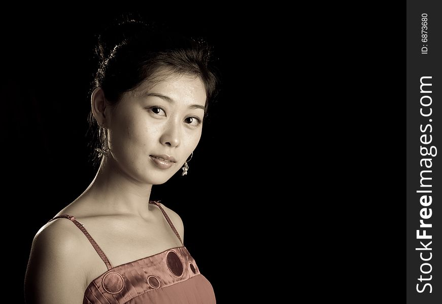 Cute asian lady isolated on black background