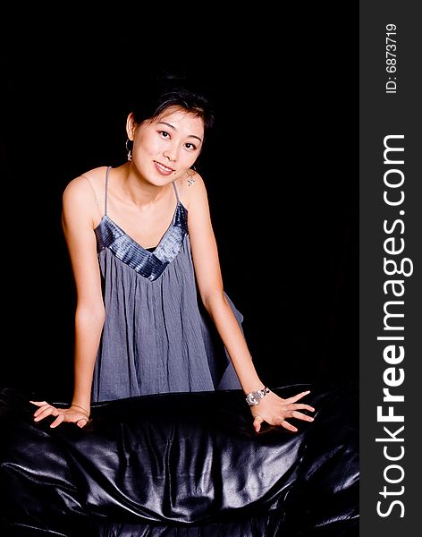 Attractive Asian female model in skirt with smile. Attractive Asian female model in skirt with smile