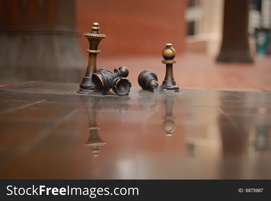 Brass chess figures taken in Portland Oregon's town square. Brass chess figures taken in Portland Oregon's town square