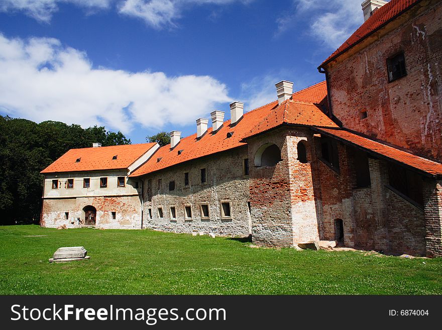 Castle with green grass and blue sky