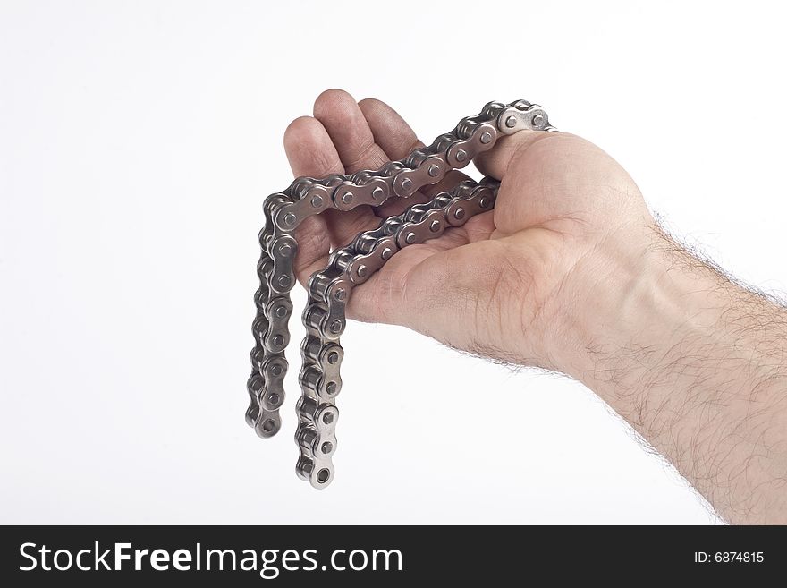 Hand with metal link chain on a white