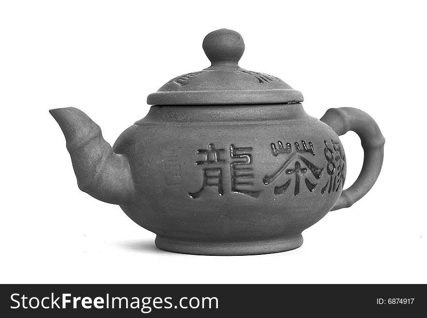 East black and white teapot on white background with a little shadow. East black and white teapot on white background with a little shadow