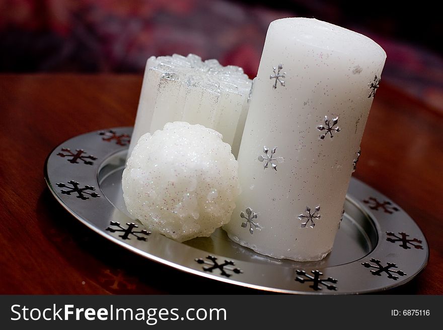 Group of pure white christmas candles on a tray. Group of pure white christmas candles on a tray