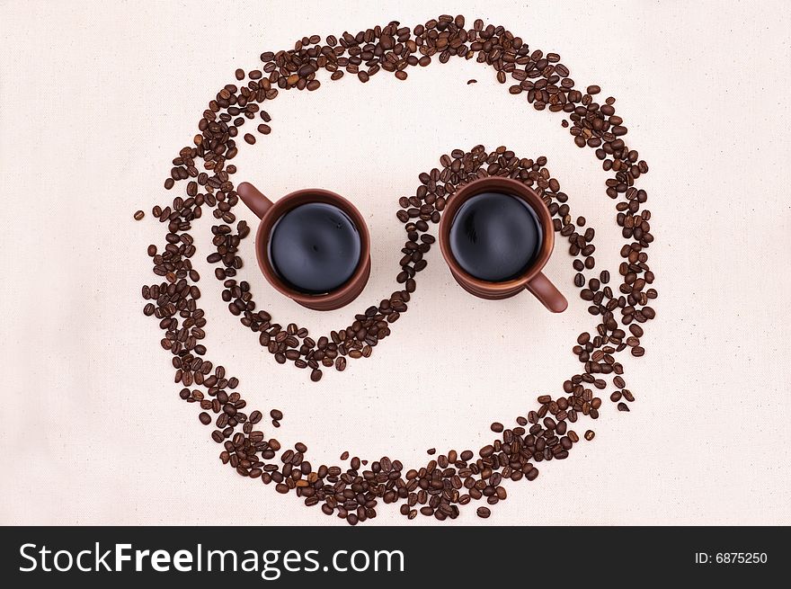 Two cups of coffee stand in a in the yin yang symbol
