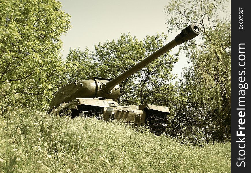 Old russian tank T-34 in the green bushes. Old russian tank T-34 in the green bushes