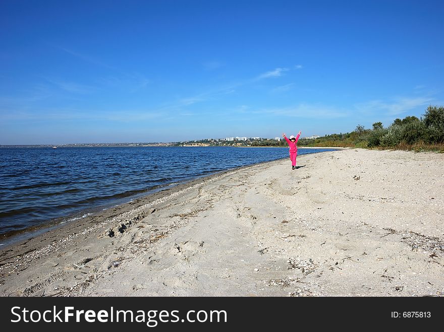 Running child on river shore