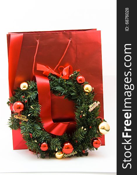 Red gift bag with Christmas decoration and red ribbon. Red gift bag with Christmas decoration and red ribbon