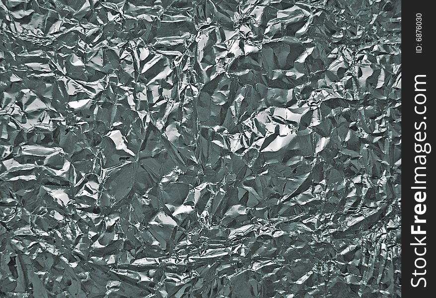 Background of metal foil with reflections. Background of metal foil with reflections