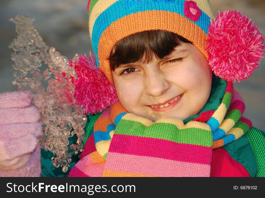 Funny child with golden ice