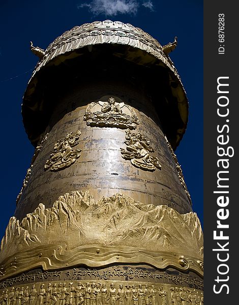 Tibetan Buddhist Prayer in Shangri-la, largest prayer wheel in the world. Tibetan Buddhist Prayer in Shangri-la, largest prayer wheel in the world