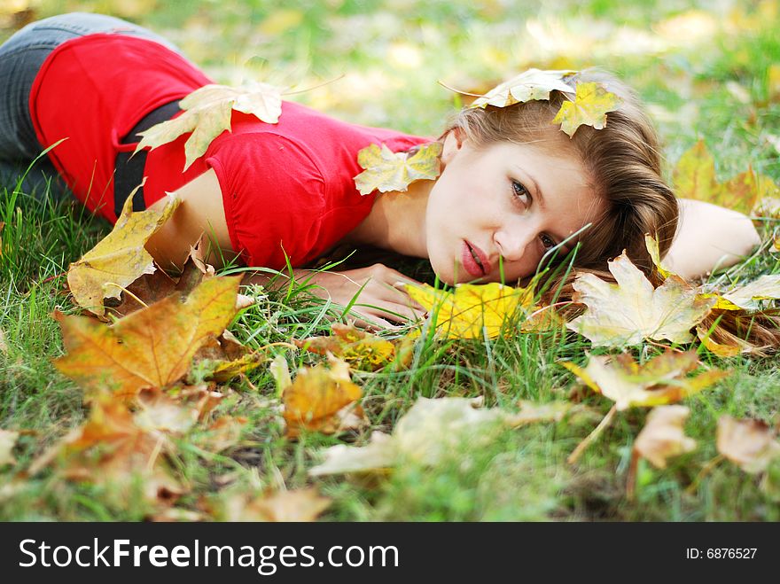 Young woman and leaves