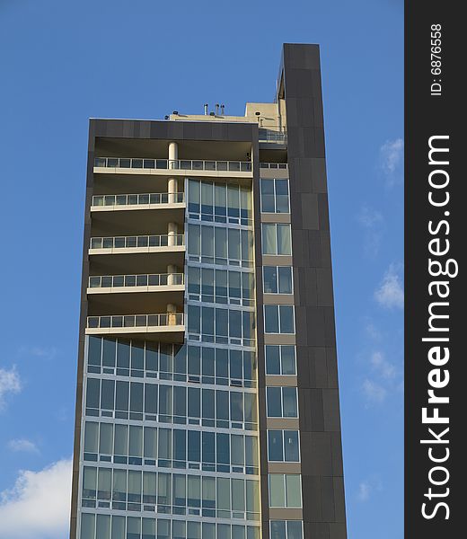 Modern west side loft building on blue sky background. Modern west side loft building on blue sky background.