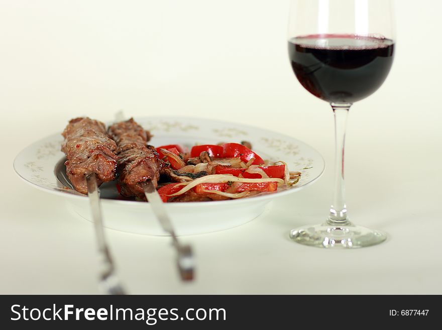 Image of grilled meat and wine