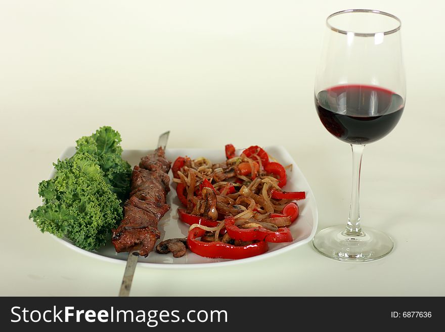 Image of grilled meat and wine