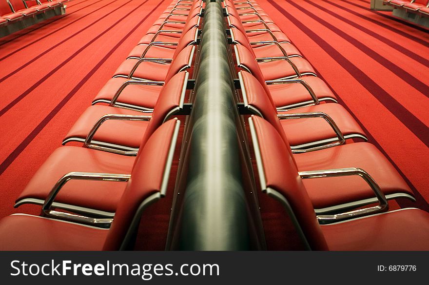 Photo of red chairs in airport