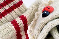 Woollen Hand-made Socks With A Wooden Lady-bird Royalty Free Stock Photos Woollen Hand-made Socks With A Wooden Lady-bird Royalty Free Stock Photos