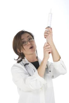 Doctor Holding A Big Syringe Royalty Free Stock Photography