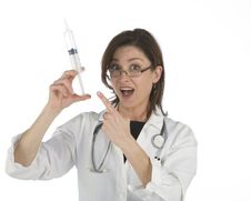 Doctor Holding A Big Syringe Royalty Free Stock Images