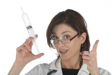Doctor Holding A Big Syringe Stock Images