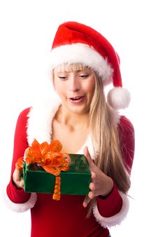 Happily Surprised Girl With A Christmas Present Royalty Free Stock Photos
