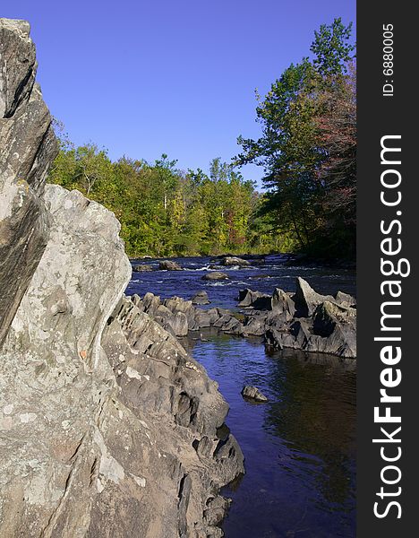 A view of river with rock wall. A view of river with rock wall