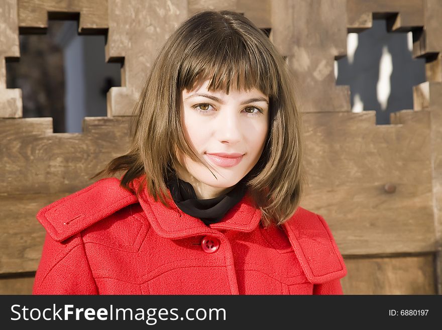 Woman Portrait On The Wooden Background