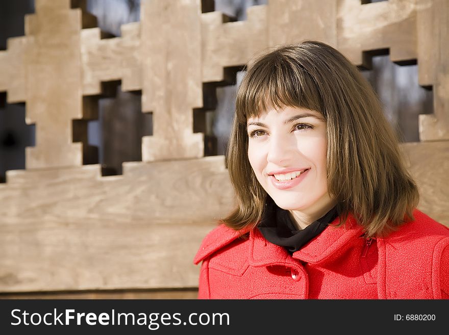 Pretty Girl On The Wooden Background