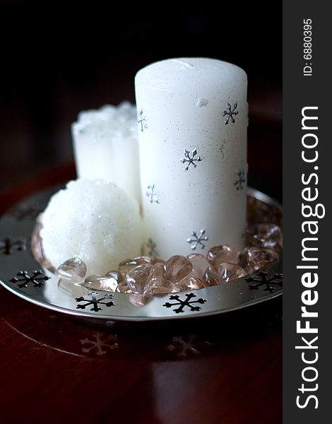 Three christmas candles decorated with silver snowflakes. Three christmas candles decorated with silver snowflakes