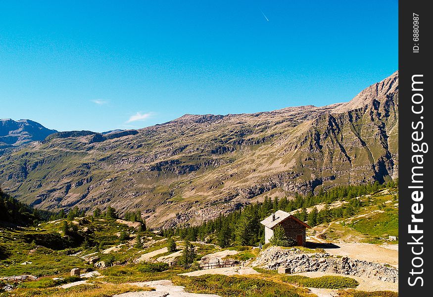 An alpine landscape with a refuge (called 'Jervis') in Italy, 'Gran paradiso' national park. An alpine landscape with a refuge (called 'Jervis') in Italy, 'Gran paradiso' national park.