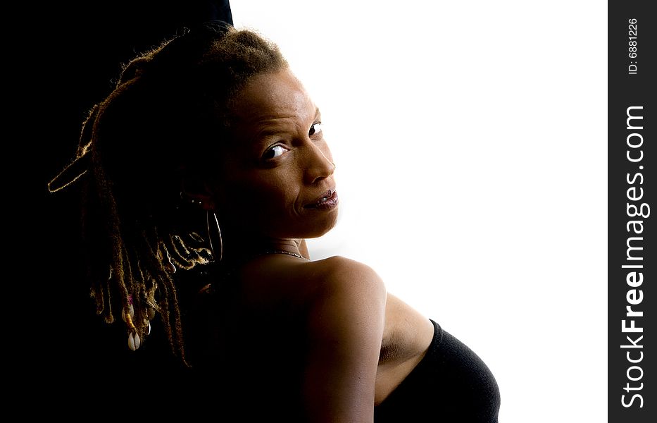 African American woman with dreadlocks against black and white wall. African American woman with dreadlocks against black and white wall