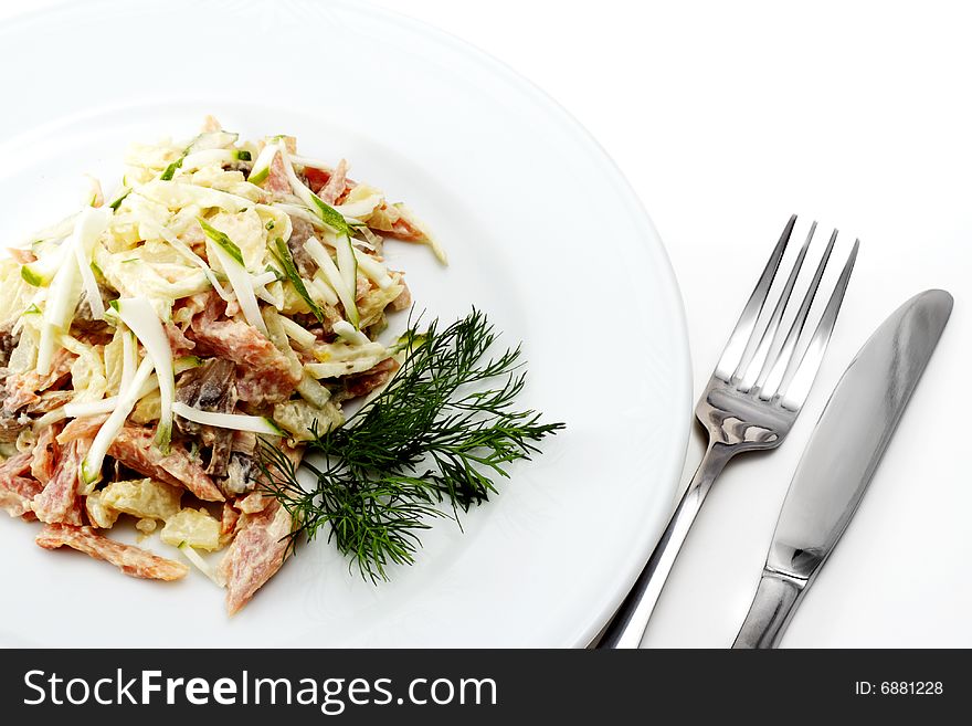 Salad Comprises Chopped Ham, Cucumber and Cheese Dressed Dill. Isolated on White Background