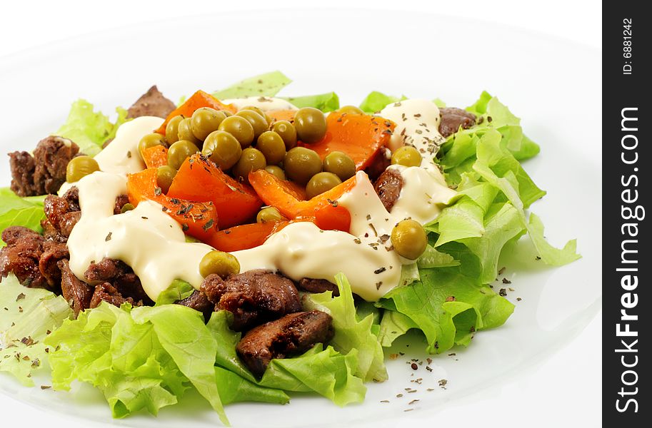 Chicken Salad Composed Chicken Liver and Pepper Dressed with Salad Leaves and Green Peas. Isolated on White Background