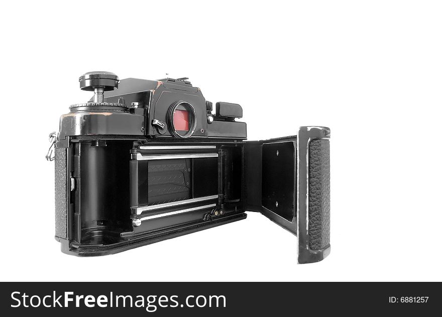 Vintage 1970's 35mm camera with open film loading door isolated on white. Vintage 1970's 35mm camera with open film loading door isolated on white