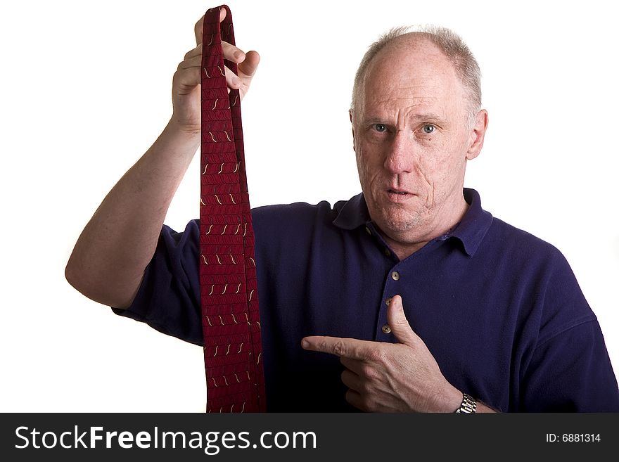 An older bald guy pointing to a tie with a question on his face. An older bald guy pointing to a tie with a question on his face
