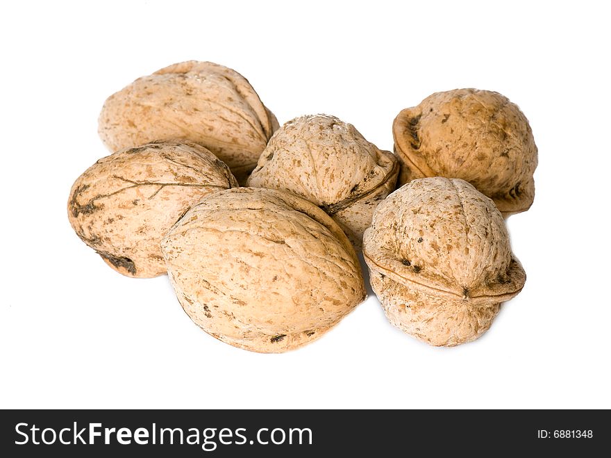 Walnuts in a shell on a white background