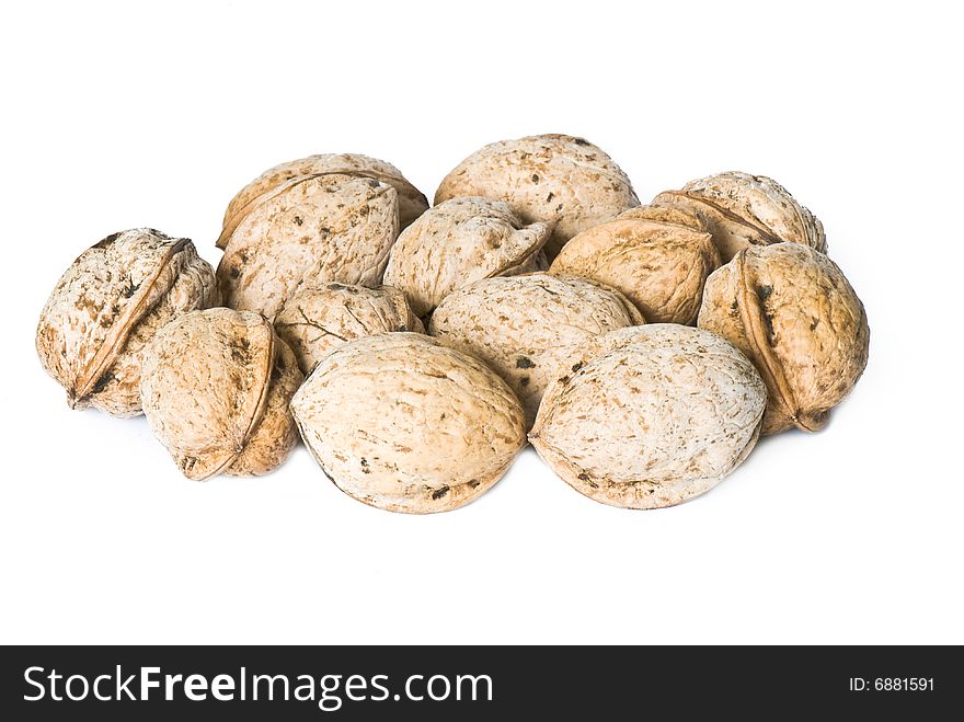 Walnuts in a shell on a white background