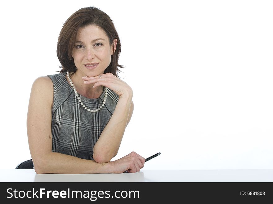 Portrait of happy businesswoman with a pen in hand