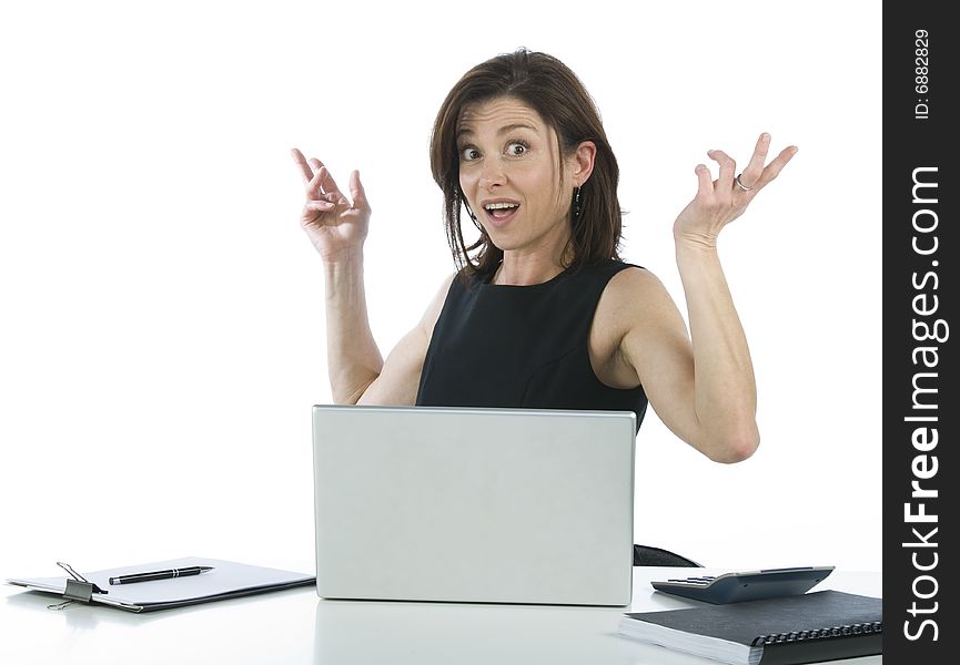 Beautiful businesswoman in her office surprised on a white background