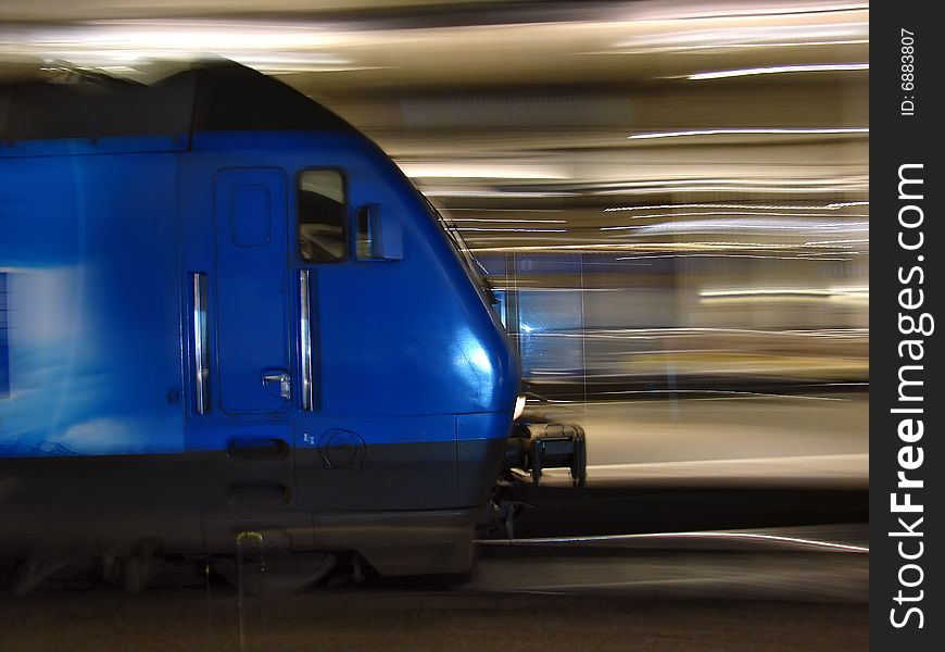 Blue underground train running