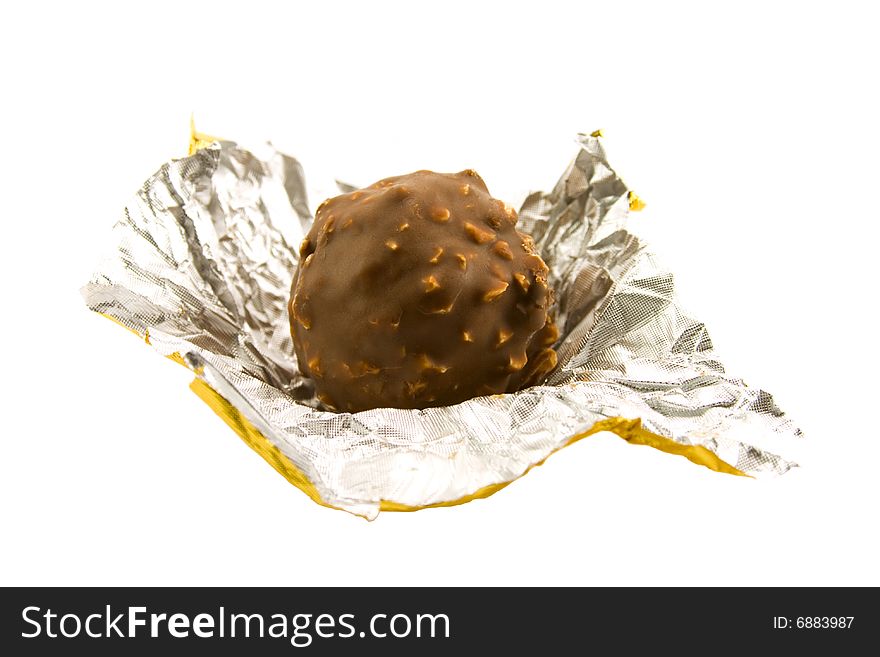 Chocolate ball with huzelnuts isolated on white background