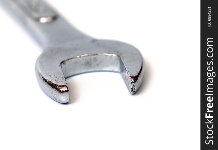 Close-up of steel spanner on white background