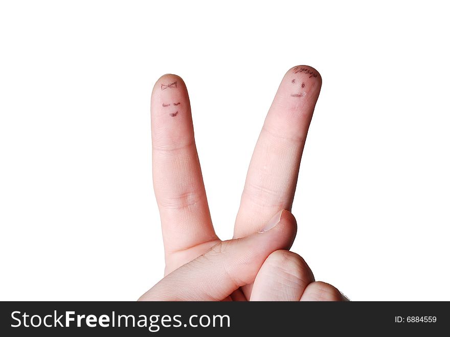 Two human fingers with drawing face on them