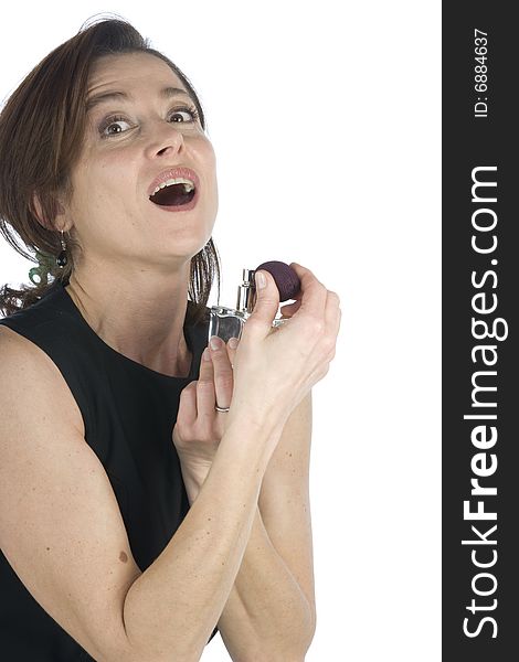 Sensual woman applying perfume on her body on a white background