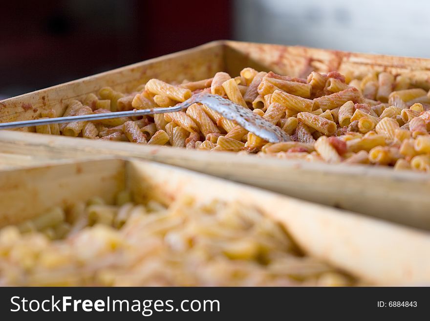 Two container of pasta ready to be served in a restaurant. Two container of pasta ready to be served in a restaurant