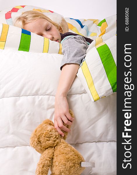 Sleeping young cute child in a colorful bed. Sleeping young cute child in a colorful bed