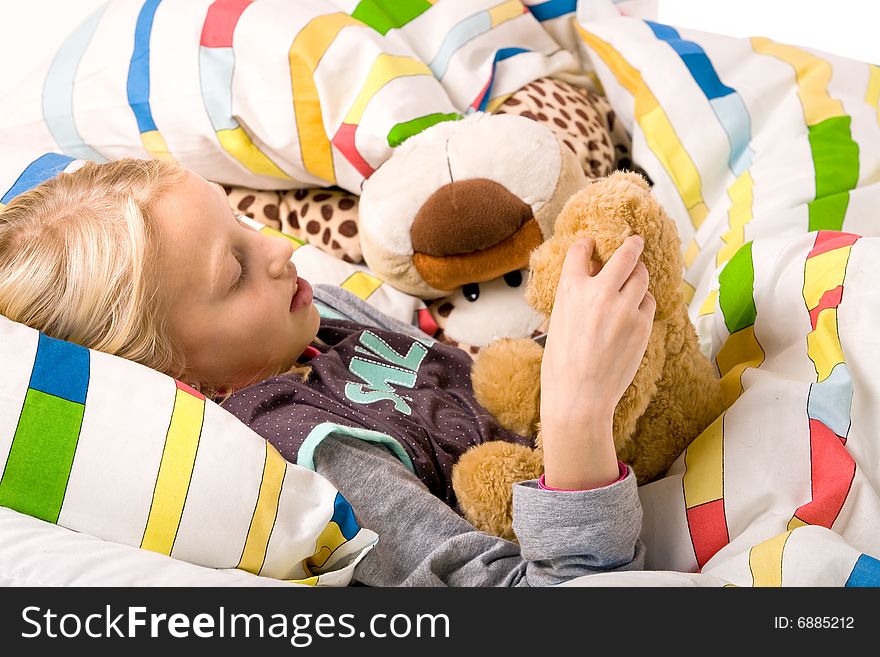 Sleeping young cute child in a colorful bed. Sleeping young cute child in a colorful bed