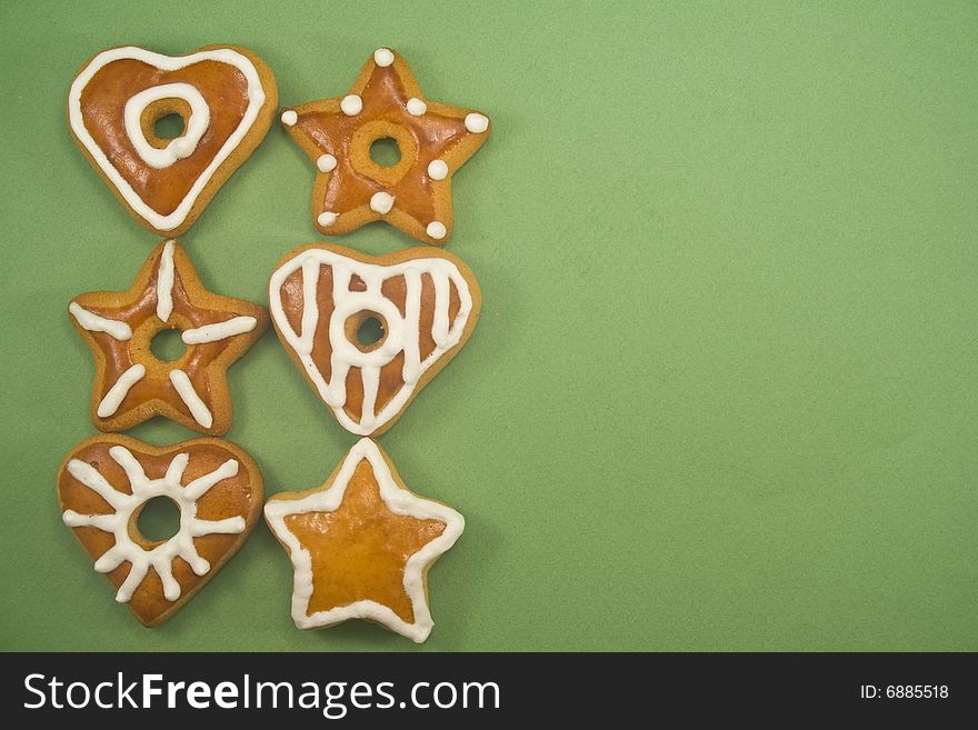 Gingerbread cookies in two lines against green background with ad space on right. Gingerbread cookies in two lines against green background with ad space on right