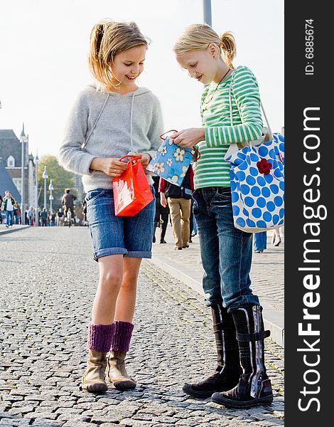 Two young children hanging around the streets while shopping. Two young children hanging around the streets while shopping